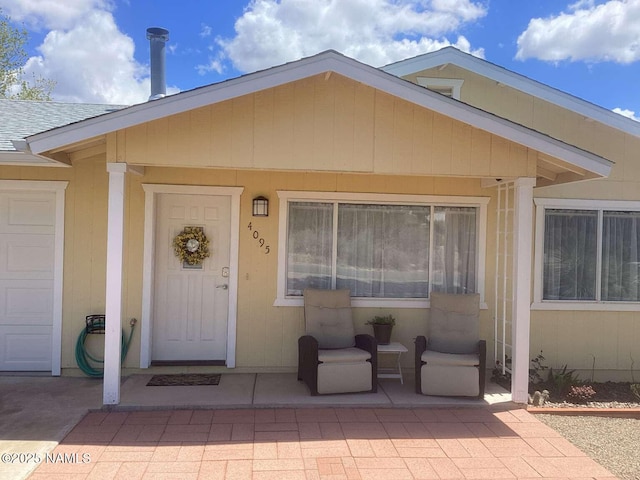property entrance with a garage