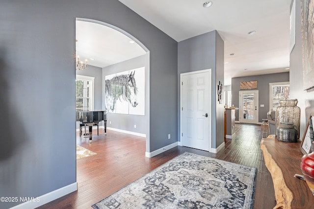 1533 S Minstrel Ln, Williams, AZ 86046 - entryway with arched walkways, wood finished floors, a chandelier, and recessed lighting