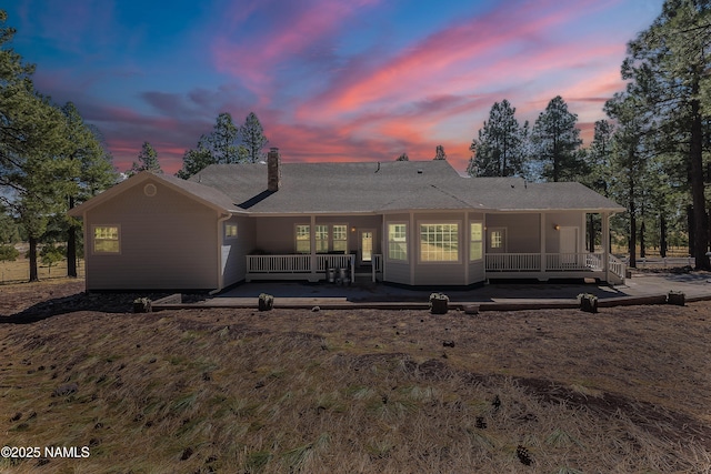 1533 S Minstrel Ln, Williams, AZ 86046 - rear view of house with covered porch