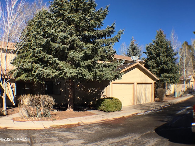 exterior space with a garage