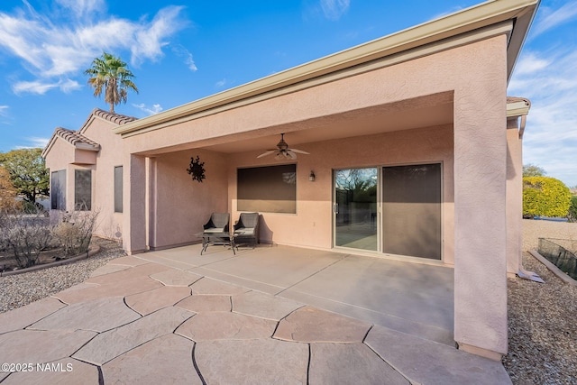 view of patio featuring ceiling fan