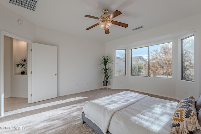 bedroom with ceiling fan and light colored carpet