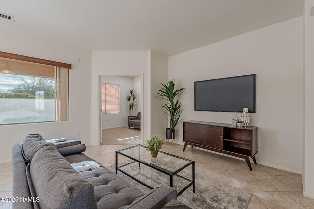 living room with light tile patterned floors