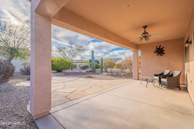 view of patio / terrace featuring ceiling fan