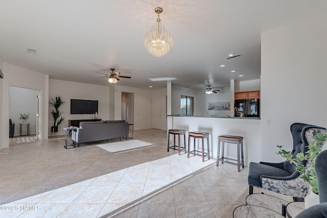 tiled living room featuring ceiling fan