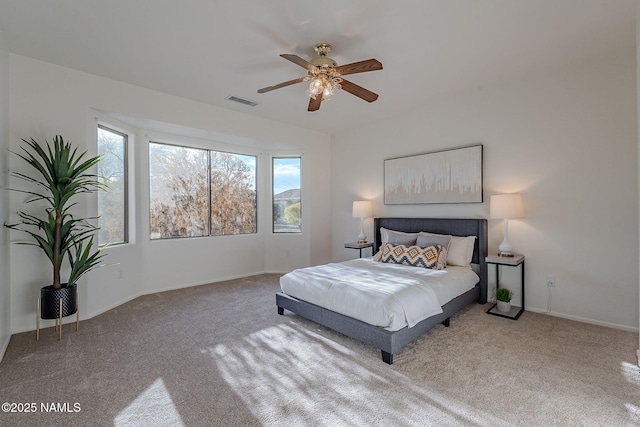 bedroom with light carpet and ceiling fan