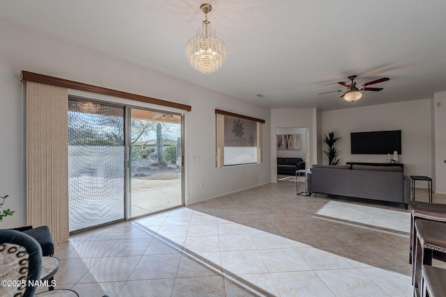 tiled living room with ceiling fan with notable chandelier