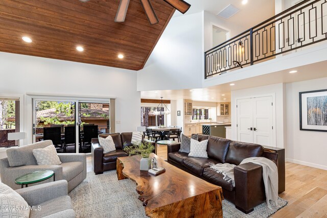 1451 N Mariposa Rd, Flagstaff, AZ 86004 - living room with high vaulted ceiling, light wood-type flooring, recessed lighting, baseboards, and wood ceiling