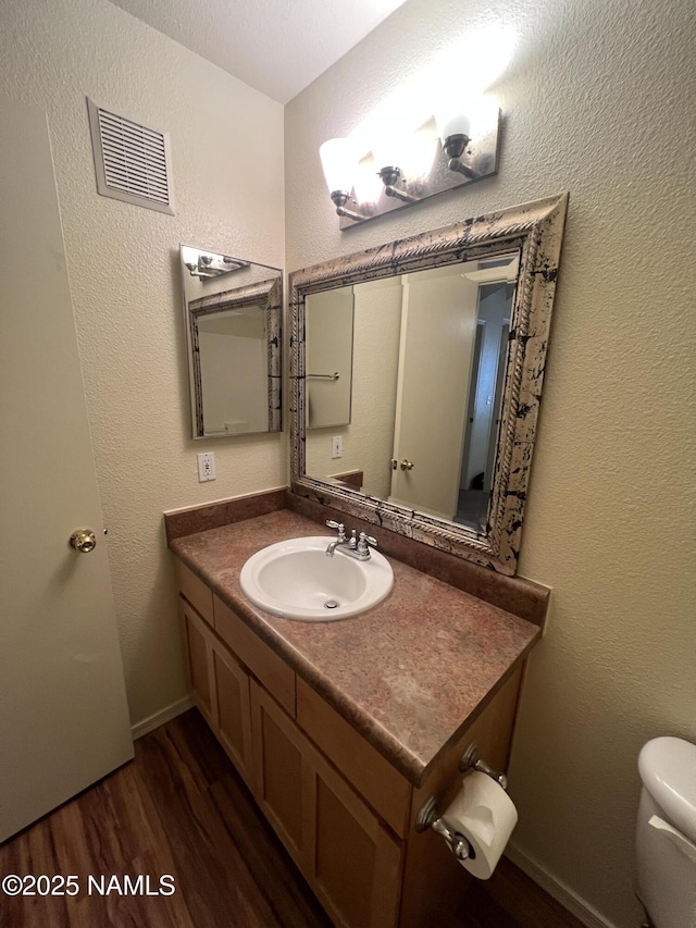 1185 W University Dr Unit 15-222, Flagstaff, AZ 86001 - half bath with vanity and wood finished floors