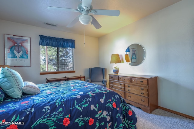 bedroom featuring baseboards, a ceiling fan, carpet, and visible vents
