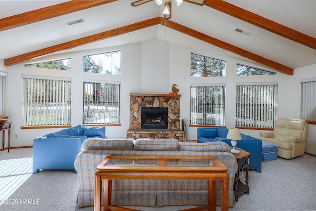 living area featuring carpet floors, visible vents, a fireplace, beamed ceiling, and ceiling fan