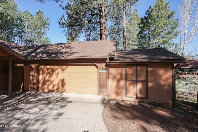 garage featuring driveway