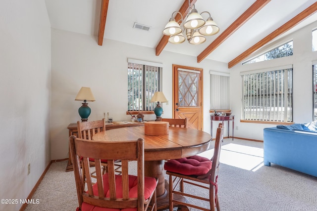 dining area with light colored carpet, a chandelier, baseboards, vaulted ceiling with beams, and visible vents