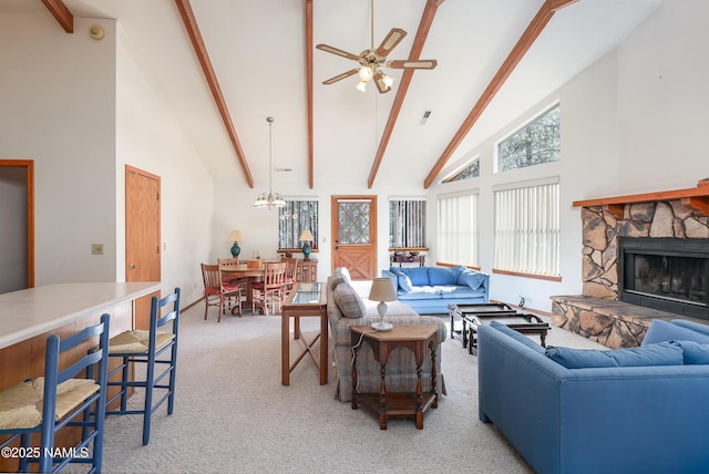living room featuring beamed ceiling, a ceiling fan, high vaulted ceiling, and light carpet