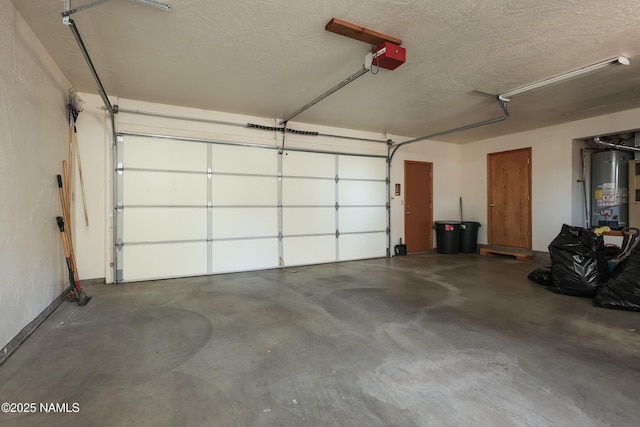 garage with a garage door opener and gas water heater