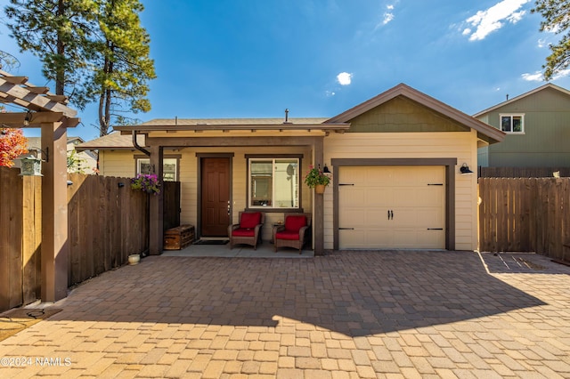 ranch-style home featuring a garage