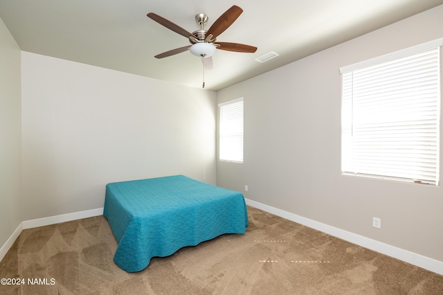 bedroom with ceiling fan and carpet flooring