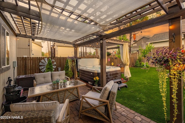 view of patio featuring outdoor lounge area, a hot tub, and a pergola