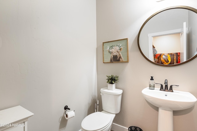 bathroom with sink and toilet