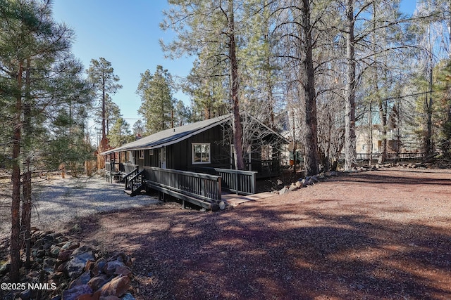 view of side of home featuring a deck