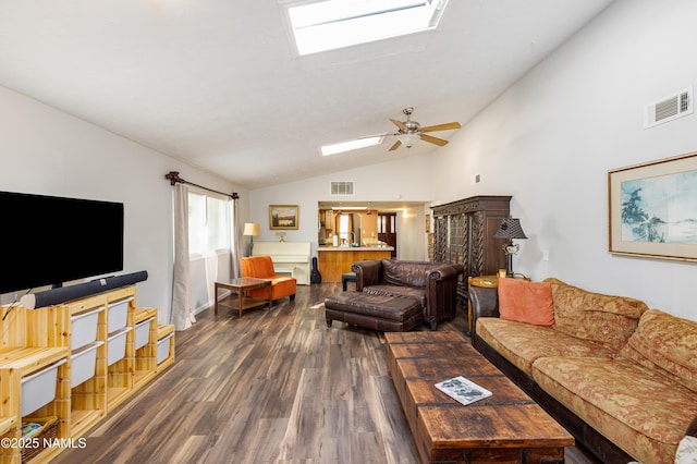 3000 E Matterhorn Dr, Flagstaff, AZ 86004 - living area with vaulted ceiling, dark wood-style flooring, a skylight, and ceiling fan