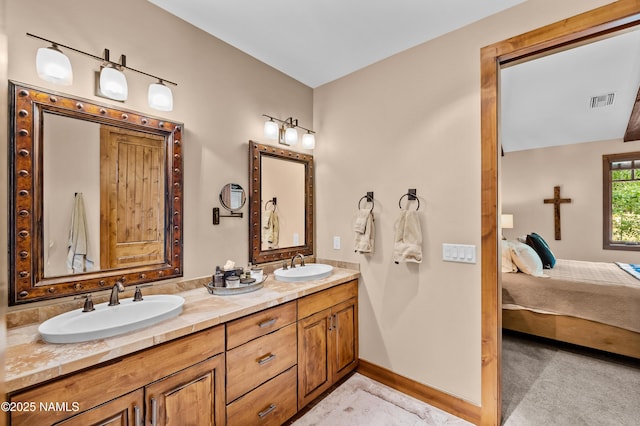 2047 E Del Rae Dr Unit 163, Flagstaff, AZ 86005 - ensuite bathroom featuring double vanity and baseboards