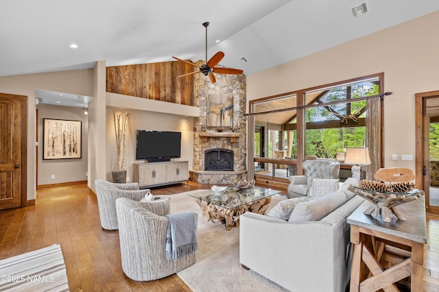 2047 E Del Rae Dr Unit 163, Flagstaff, AZ 86005 - living room featuring hardwood / wood-style floors, ceiling fan, a stone fireplace, and high vaulted ceiling