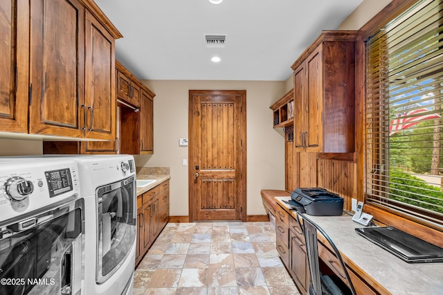 2047 E Del Rae Dr Unit 163, Flagstaff, AZ 86005 - washroom featuring cabinet space, washing machine and clothes dryer, stone finish flooring, and recessed lighting