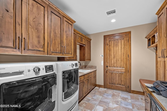 2047 E Del Rae Dr Unit 163, Flagstaff, AZ 86005 - laundry room with washer and clothes dryer, cabinet space, stone finish flooring, and recessed lighting