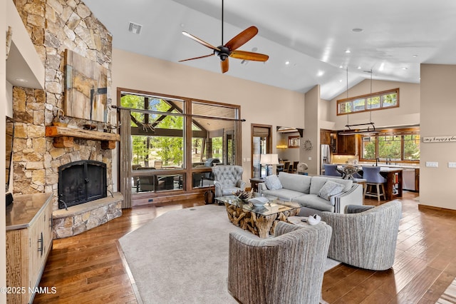 2047 E Del Rae Dr Unit 163, Flagstaff, AZ 86005 - living room with ceiling fan, high vaulted ceiling, a fireplace, and hardwood / wood-style floors