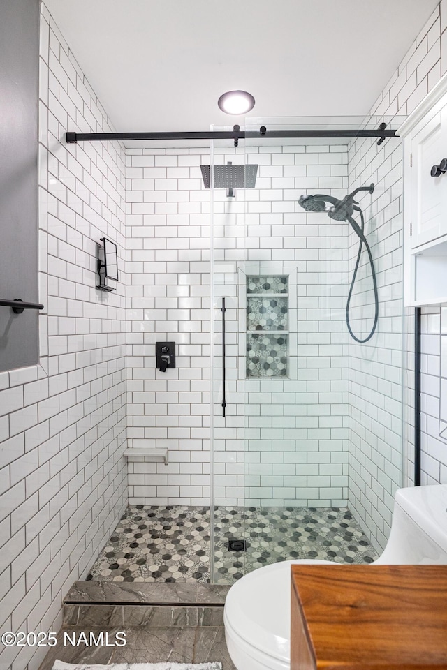 full bathroom with toilet and a stall shower