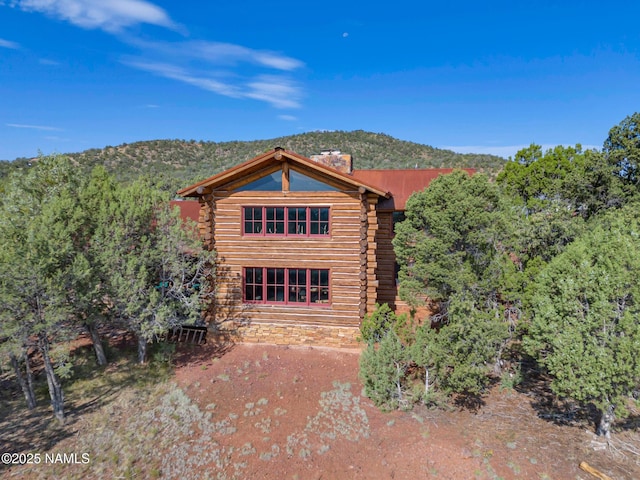 rear view of property with a mountain view