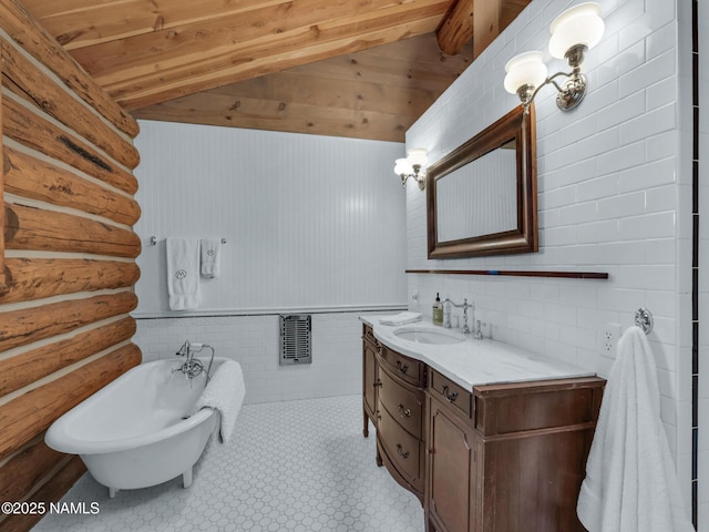 bathroom featuring tile patterned floors, vanity, a bathtub, lofted ceiling with beams, and wooden ceiling