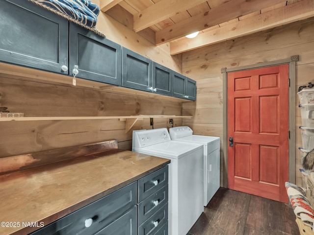 laundry area with washing machine and clothes dryer, wood walls, cabinets, and wood ceiling