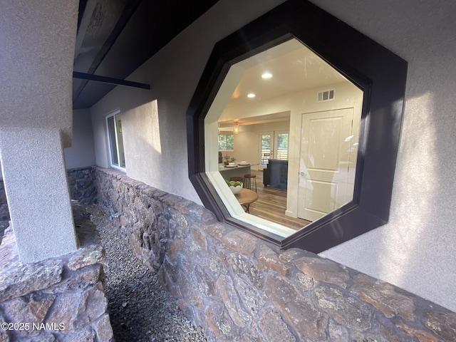 1024 E Hillcrest Dr, Flagstaff, AZ 86004 - view of exterior entry featuring stucco siding and stone siding