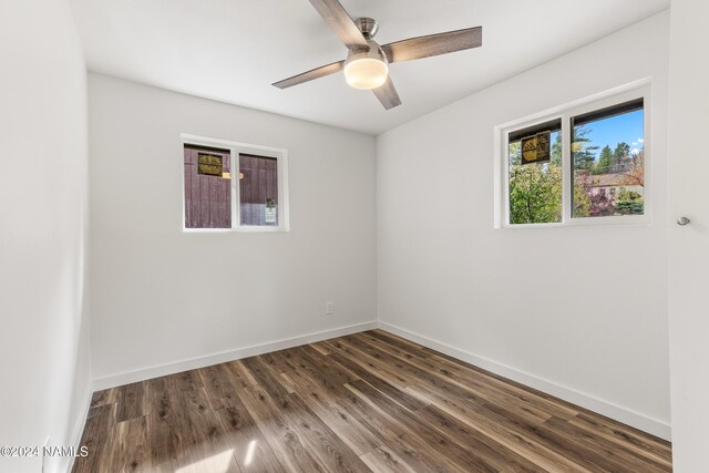 1024 E Hillcrest Dr, Flagstaff, AZ 86004 - empty room with a ceiling fan, dark wood-style floors, and baseboards