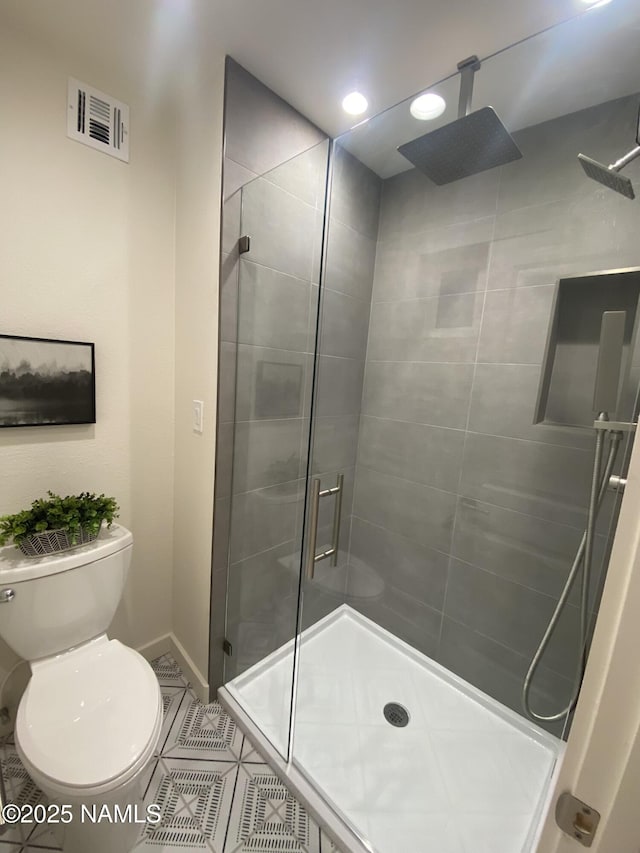 1024 E Hillcrest Dr, Flagstaff, AZ 86004 - bathroom featuring a stall shower, toilet, tile patterned floors, baseboards, and recessed lighting
