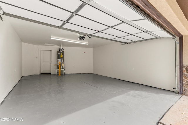 1024 E Hillcrest Dr, Flagstaff, AZ 86004 - garage featuring gas water heater and a garage door opener
