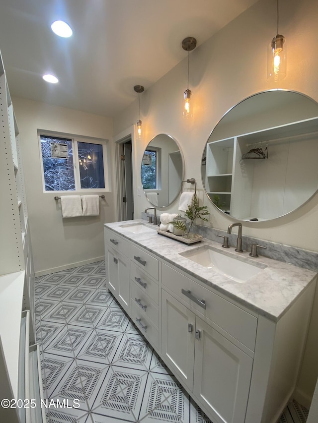 1024 E Hillcrest Dr, Flagstaff, AZ 86004 - full bathroom featuring double vanity, baseboards, recessed lighting, and tile patterned floors