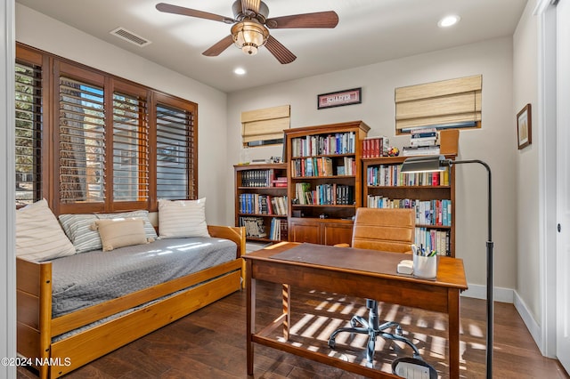 interior space with ceiling fan and dark hardwood / wood-style flooring