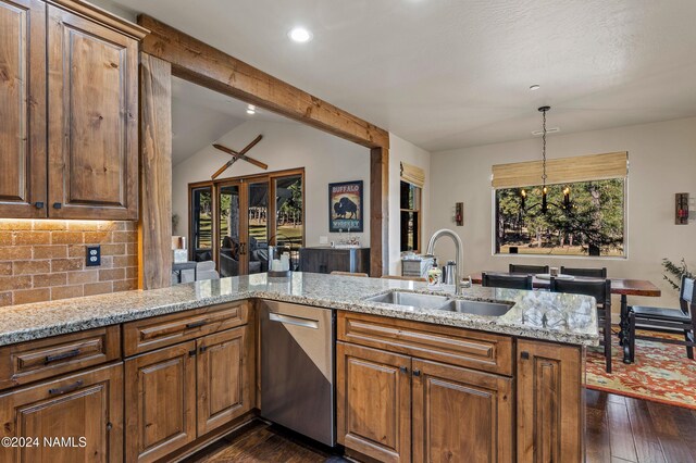 kitchen featuring dishwasher, decorative backsplash, sink, kitchen peninsula, and light stone counters