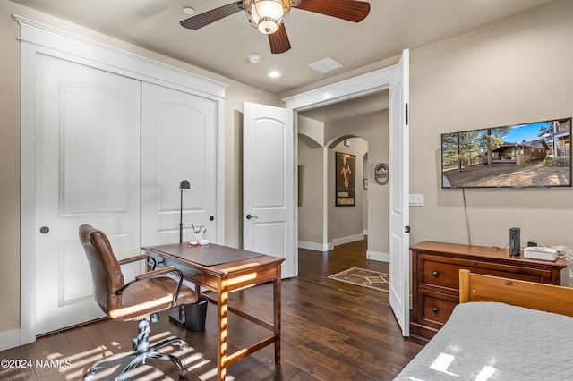 office space with ceiling fan and dark hardwood / wood-style floors