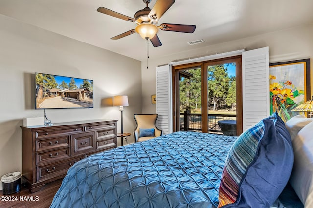 bedroom with dark wood-type flooring, ceiling fan, and access to outside