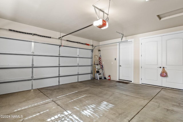 garage featuring a garage door opener