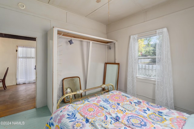 bedroom with hardwood / wood-style floors