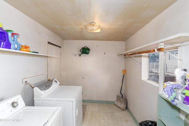 laundry area with washing machine and clothes dryer