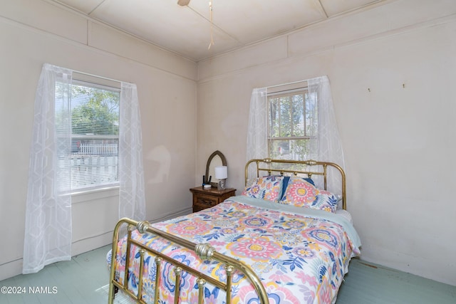 bedroom with multiple windows