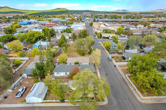 birds eye view of property with a mountain view