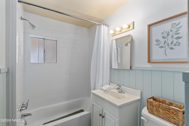 full bathroom featuring toilet, vanity, and shower / bath combination with curtain