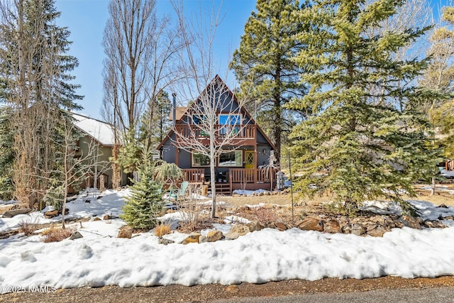 view of snow covered house